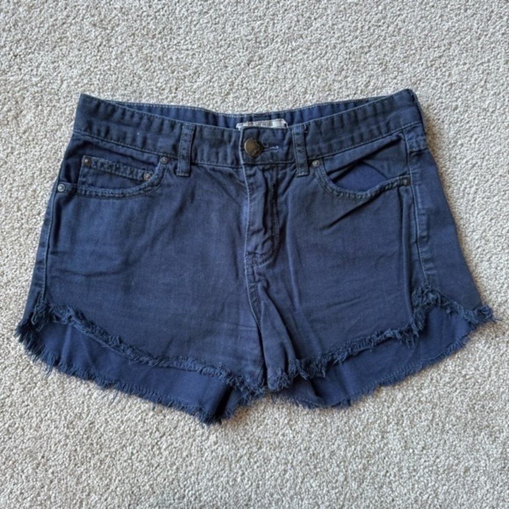 Free People navy blue denim shorts with raw hemline and fringe size 25